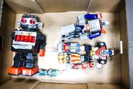 A collection of Robot Figures including Hong Kong made item, Transformers etc