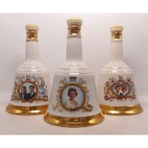 Three Sealed Wade Bells Commemorative Royal Decanters with contents. (3)