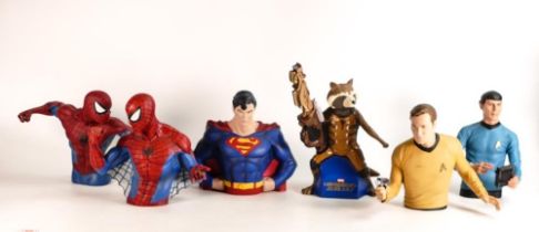 A collection of Super Hero Monogram International Inc Money Box Busts including Superman, Spiderman,