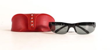 A pair of Prada sunglasses, model SPS04E, with case
