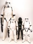 Three Stormtroopers and Tie fighter pilot figures, height of tallest 78cm (4)