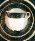Royal Doulton Carlyle pattern tea and dinner ware in two trays to include tea pot, tureens, open veg