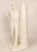 Parian Figure of Gent Standing by Ruby Goalpost, height 27cm, chip to rear of base