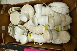 A large collection of un decorated tea cups & saucers