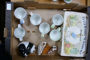 A mixed collection of items to include Disney mugs, Wedgwood Peter Rabbit nursery set, Wade panda