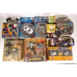 A mixed collection of Carded Figures & Vehicles including Guitar Hero God of Rock, Disney Wall E ,