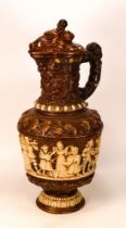 Ceramic lidded Jug with revelry scenes to body and Boar's Head to Lid - filial missing from lid -