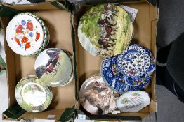A large collection of decorative wall plates (2 trays)