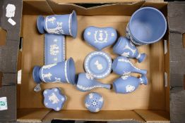 A collection of Blue Wedgwood Jasperware including vases, small planters, lidded heart shaped box,