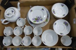 Victoria China floral patterned part teaset to include 11 saucers, teapot, sugar dish, 11 cups, 10