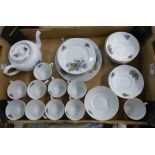 Victoria China floral patterned part teaset to include 11 saucers, teapot, sugar dish, 11 cups, 10