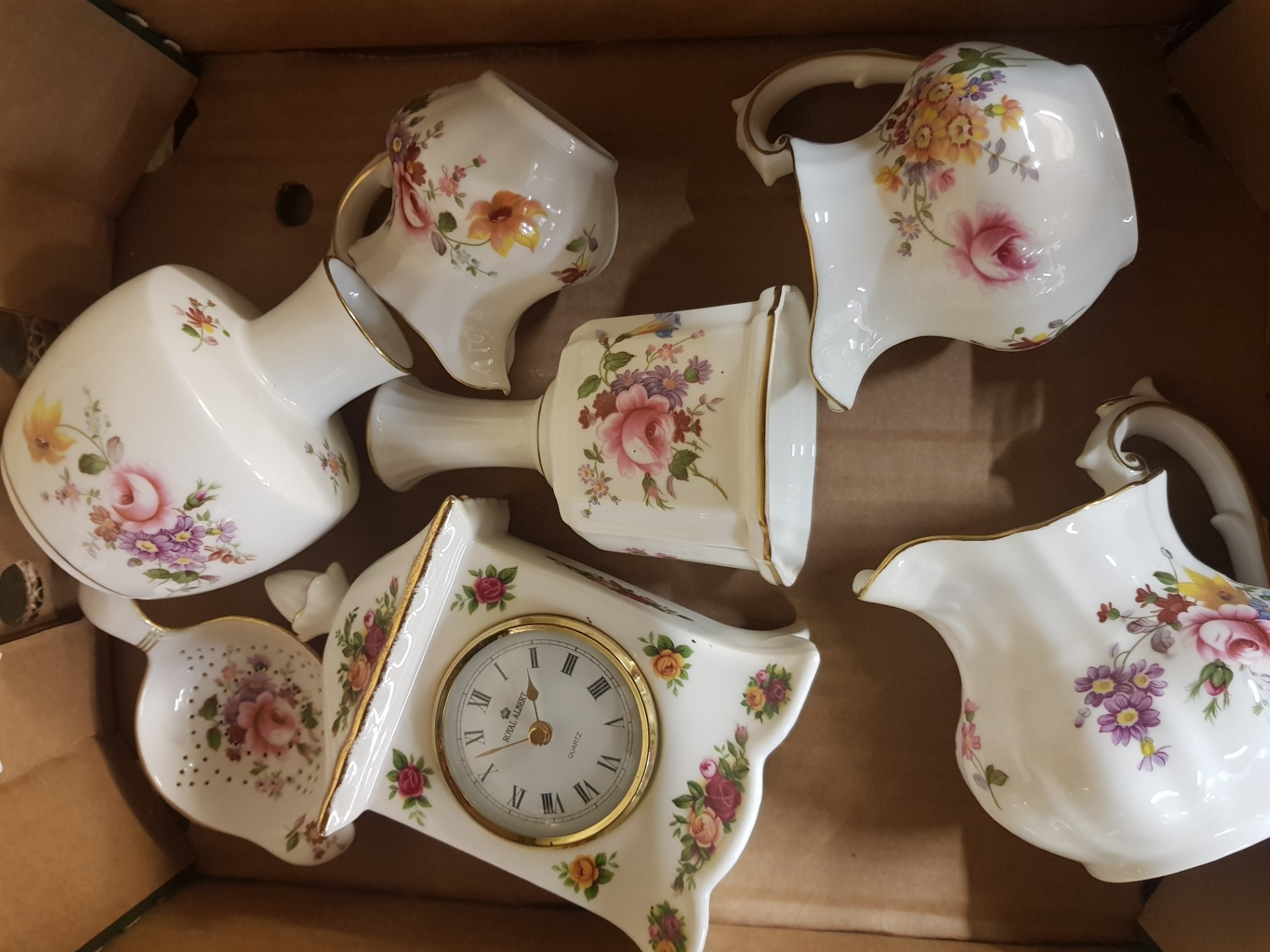 A collection of Royal Crown Derby Derby Posies items to include bell, cream jugs, vases, milk