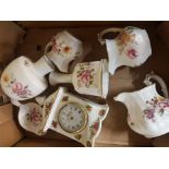 A collection of Royal Crown Derby Derby Posies items to include bell, cream jugs, vases, milk