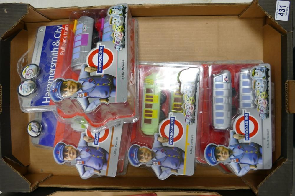 Four Underground Ernie electric trains, unopened in original packaging.