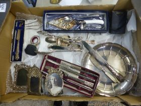A collection of metalware items to include silver handles knife, silver and Mother-of-Pearl pickle