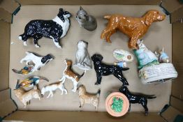 A collection of Beswick animals to include Collie, King Charles Spaniel, Labrador , cats, terriers