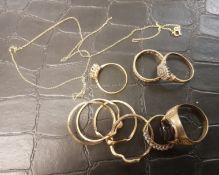 A collection of 9ct gold rings, one set with black onyx, overall weight 25.4g.
