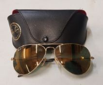 Vintage pair of Ray-Ban sunglasses with original case.