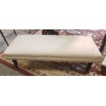 Upholstered double footstool raised on Oak supports with brass ferrals 88cm W x 41cm D x 30cm H