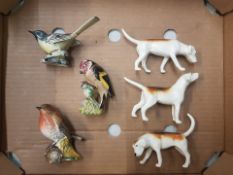 A collection of Beswick Figures to include 3 First version foxhounds together with Beswick Bird