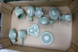 A collection of Sage Green Wedgwood Jasperware including bud vases, pin dishes, lidded boxes etc