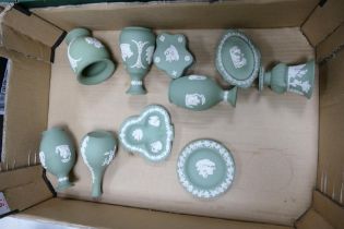 A collection of Sage Green Wedgwood Jasperware including bud vases, pin dishes, lidded boxes etc