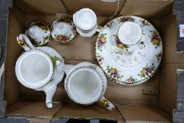 A collection of Royal Albert Old Rose patterned items including 2 teapots, cream jug, sugar bowl ,