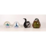 Four hand made glass paperweights, including Mdina Glass and Caithness.