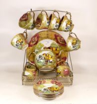 Baron China Staffs Ltd. Romany Gypsy Tea Set Displayed on a Metal Stand including Teapot, Milk Jug