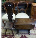 Carved dark oak spinning chair together with small dark oak occaisonal table (2)