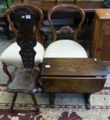 Carved dark oak spinning chair together with small dark oak occaisonal table (2)