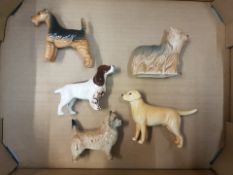 A collection of Beswick small dog figures Cairn Terrier, Cocker Spaniel, Yorkshire Terrier, Golden