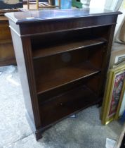 Inlaid open bookcase on bracket feet