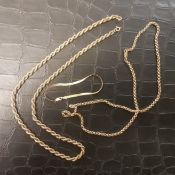 Two 9ct gold chains together with a 9ct gold bracelet, 26.7g.