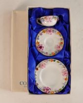 A Boxed Coalport Florally Encrusted Miniature Trio to include Cup, Saucer and Plate. Diameter of