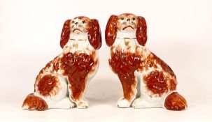 A Pair of Staffordshire Fireside Spaniels with seperate leg. Height: 19.5cm (2)