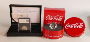 UK 2018 50p date stamp proof coin and a Coca Cola silver coin, boxed. (2)