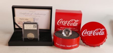 UK 2018 50p date stamp proof coin and a Coca Cola silver coin, boxed. (2)