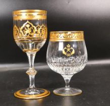 Two De Lamerie Fine Bone China heavily gilded Non Matching Wine Glasses with Saudi Arabia Crest ,