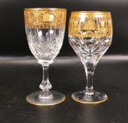 Two De Lamerie Fine Bone China heavily gilded Non Matching Wine Glasses with Arabic Motif, specially