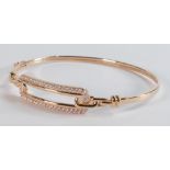 9ct rose gold buckle style bracelet set with white stones, 7.7g.