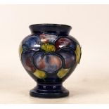 Moorcroft Footed Squat Vase in the Anemone Pattern on Blue Ground. Queen Mary Sticker to Base.