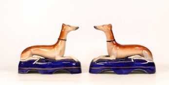 A Pair of Staffordshire Greyhound Inkwells with Cobalt Blue Base. Height: 12cm (2)