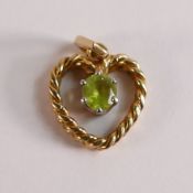 Yellow metal heart shaped pendant set with green stone,3.5g.