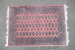 Oriental rug /carpet, believed of Persian origin, measures 180cm x 128cm appx., excl. fringes.
