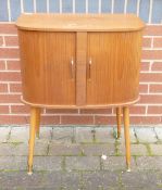 WK Möbel Mid-Century tambour Fronted Record Cabinet on Metal Fitted Castor Feet. Height: Length: