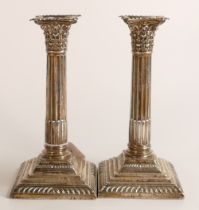 Pair of corinthian column hallmarked silver candlesticks, loaded. Height 21cm, hallmarks for