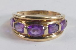 9ct gold dress ring set with 4 purple stones, ring size P, 3.9g.