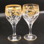 Two De Lamerie Fine Bone China heavily gilded Non Matching Wine Glasses, specially made high end