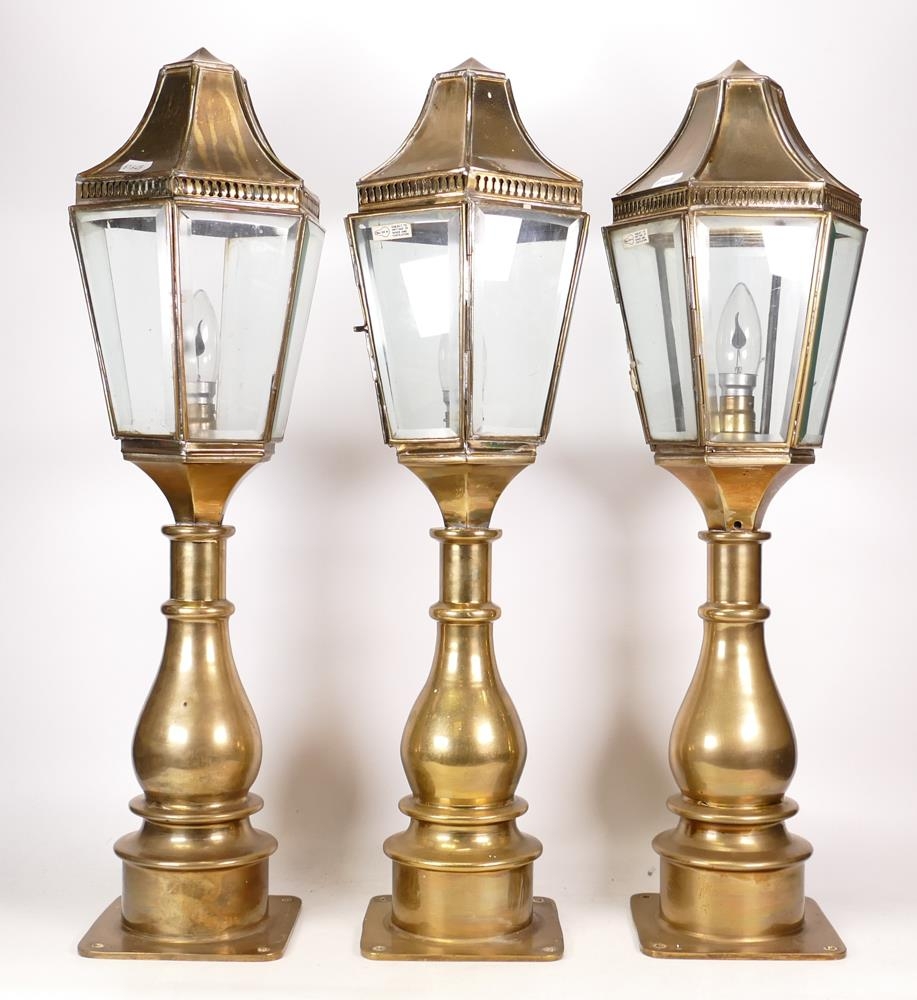 Three Matching Brass Outdoor Pillar Lamps in the style of Georgian Examples. One lamp is missing a